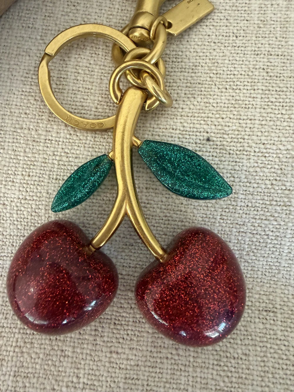 Coach Gold-Tone Cherry Keyring with Red Enamel Cherries and Green Leaves